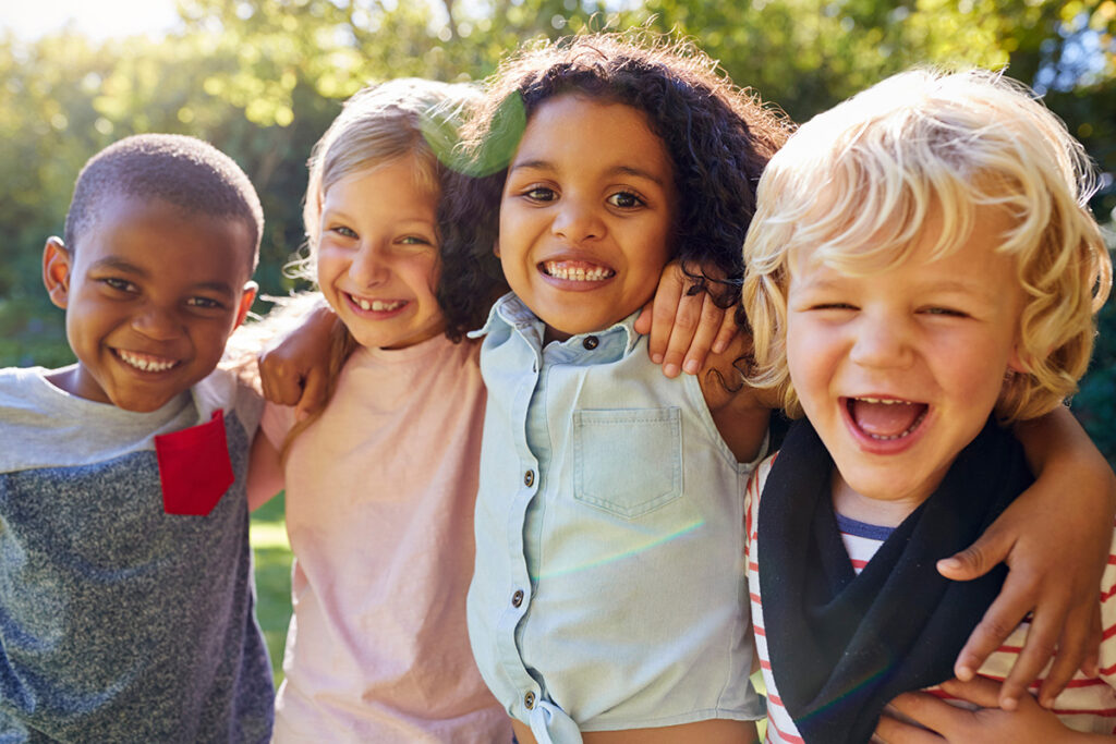 children hugging and smiling