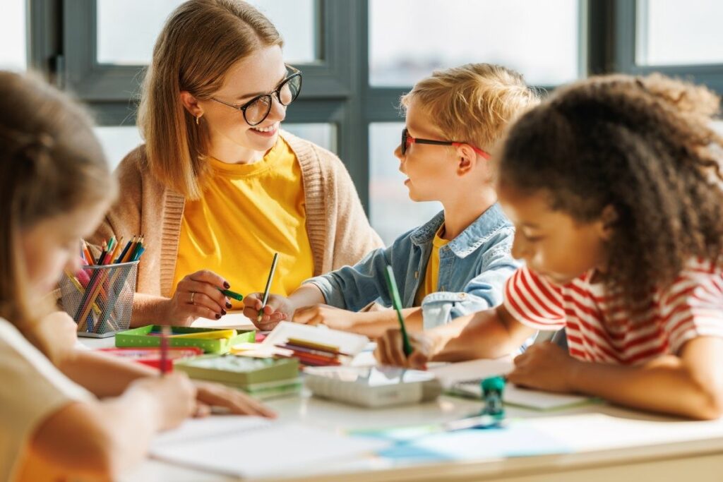 teacher and children learning