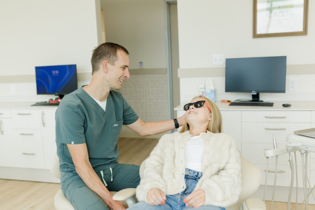 dr. johnson and patient in chair