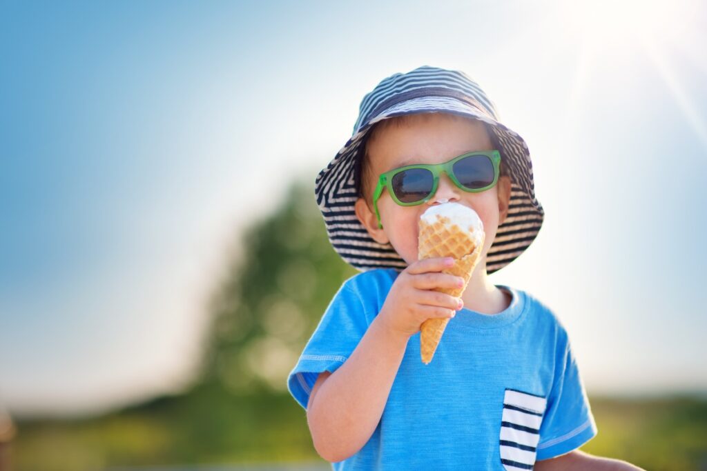 kid with ice cream and sunglasses